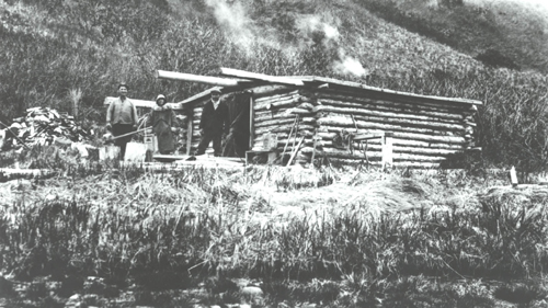 Bauman-&-Sticklers-cabin,-Mr.-and-Mrs.-Benson-on-left.jpg